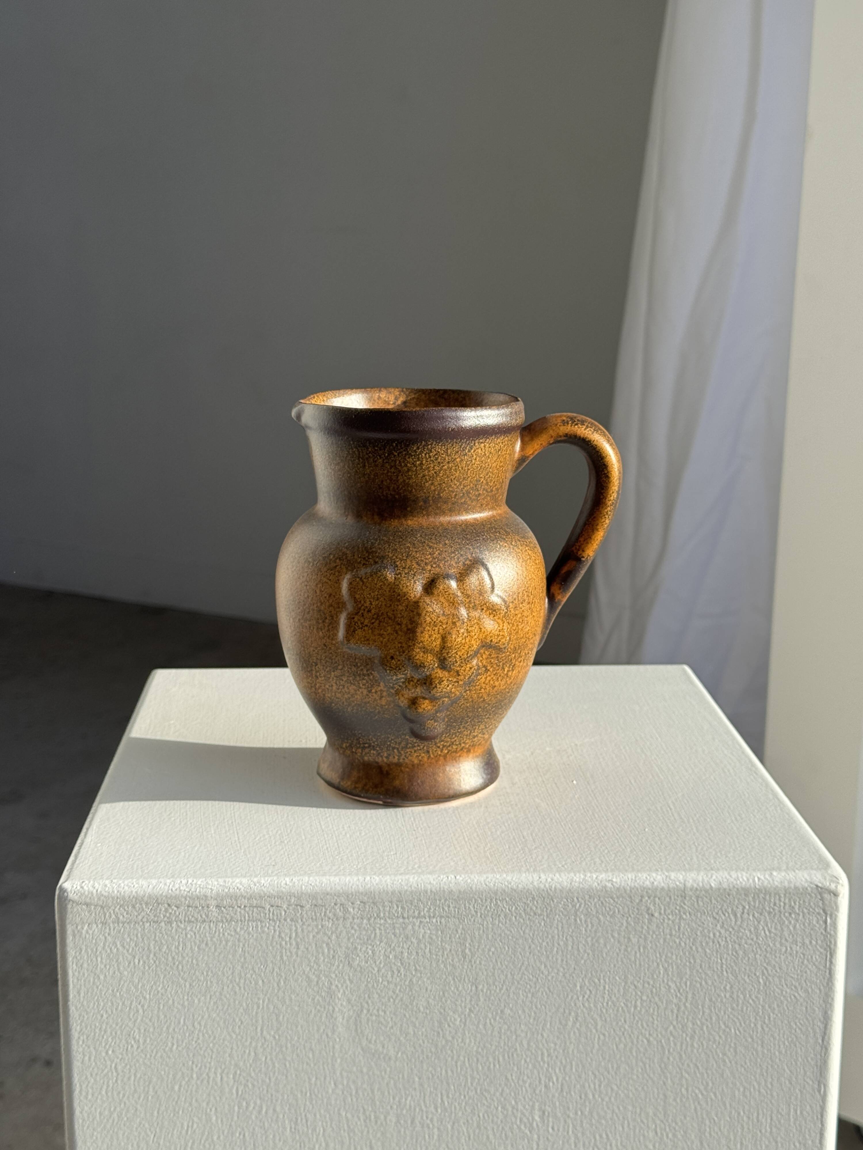Speckled stoneware jug with grape pattern H17