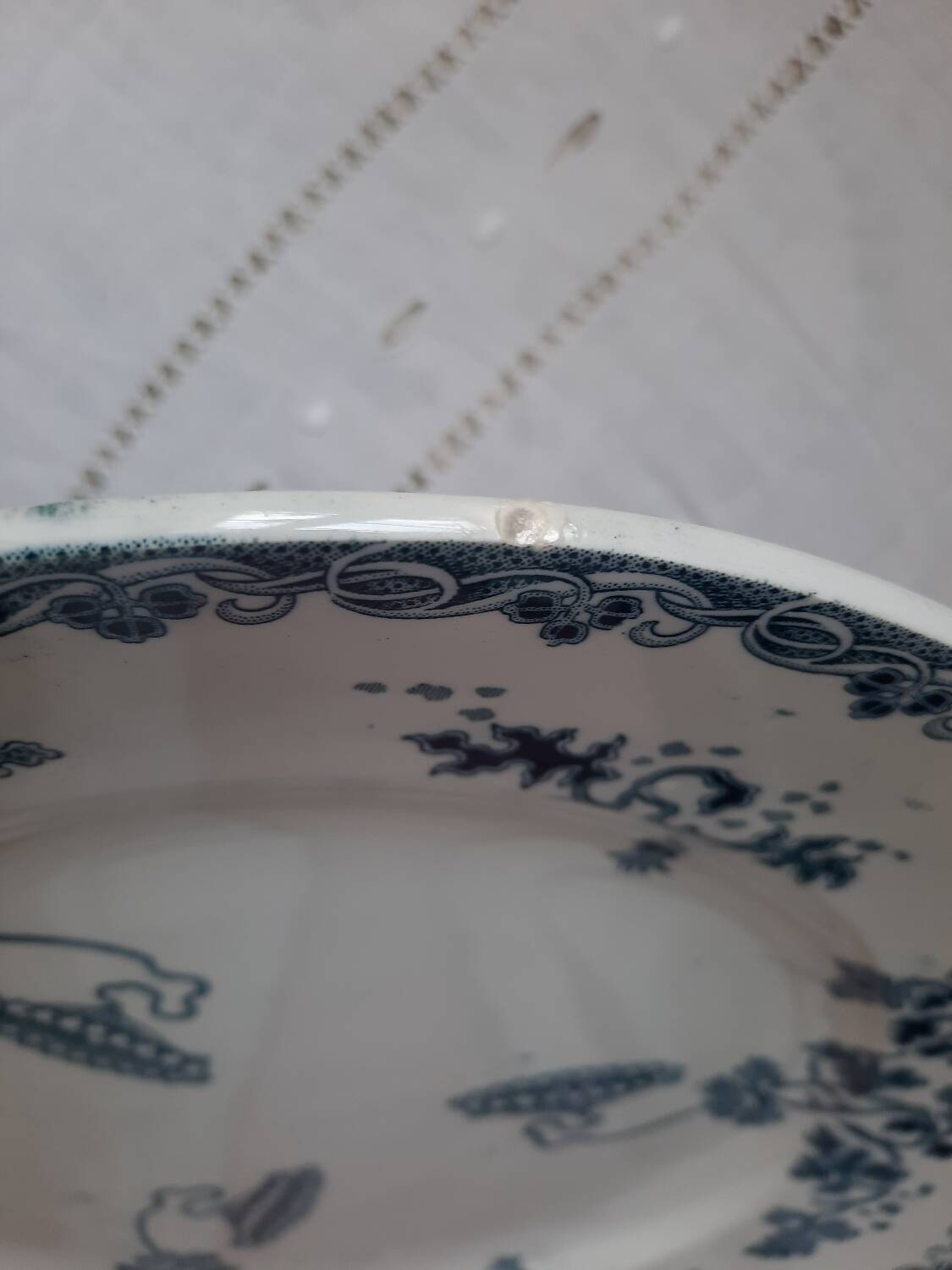 Old mismatched iron earthenware dessert plates accompanied by a dish