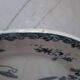 Old mismatched iron earthenware dessert plates accompanied by a dish