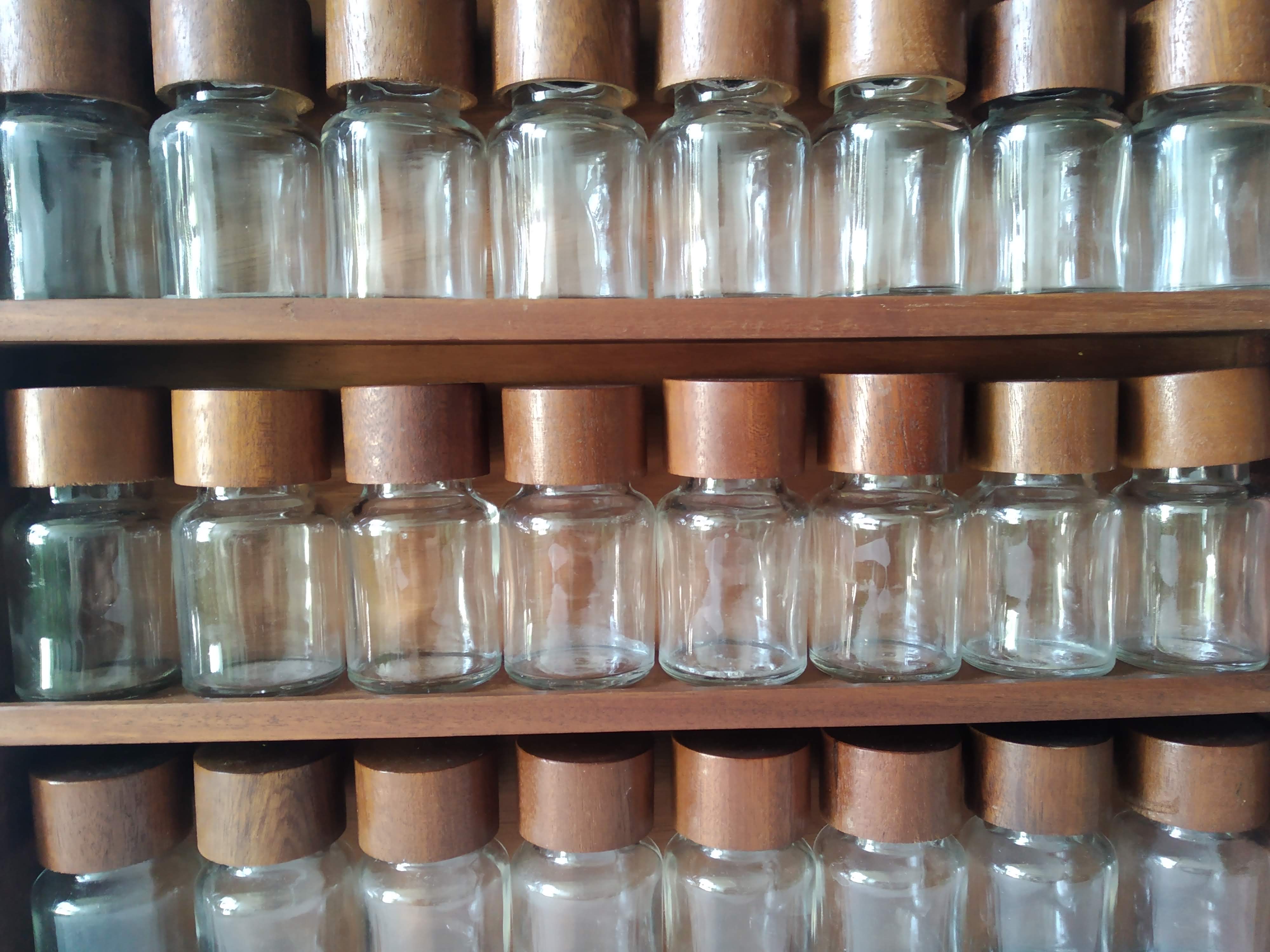 Wooden shelf with 32 vintage Cole & Mason spice jars