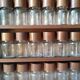 Wooden shelf with 32 vintage Cole & Mason spice jars