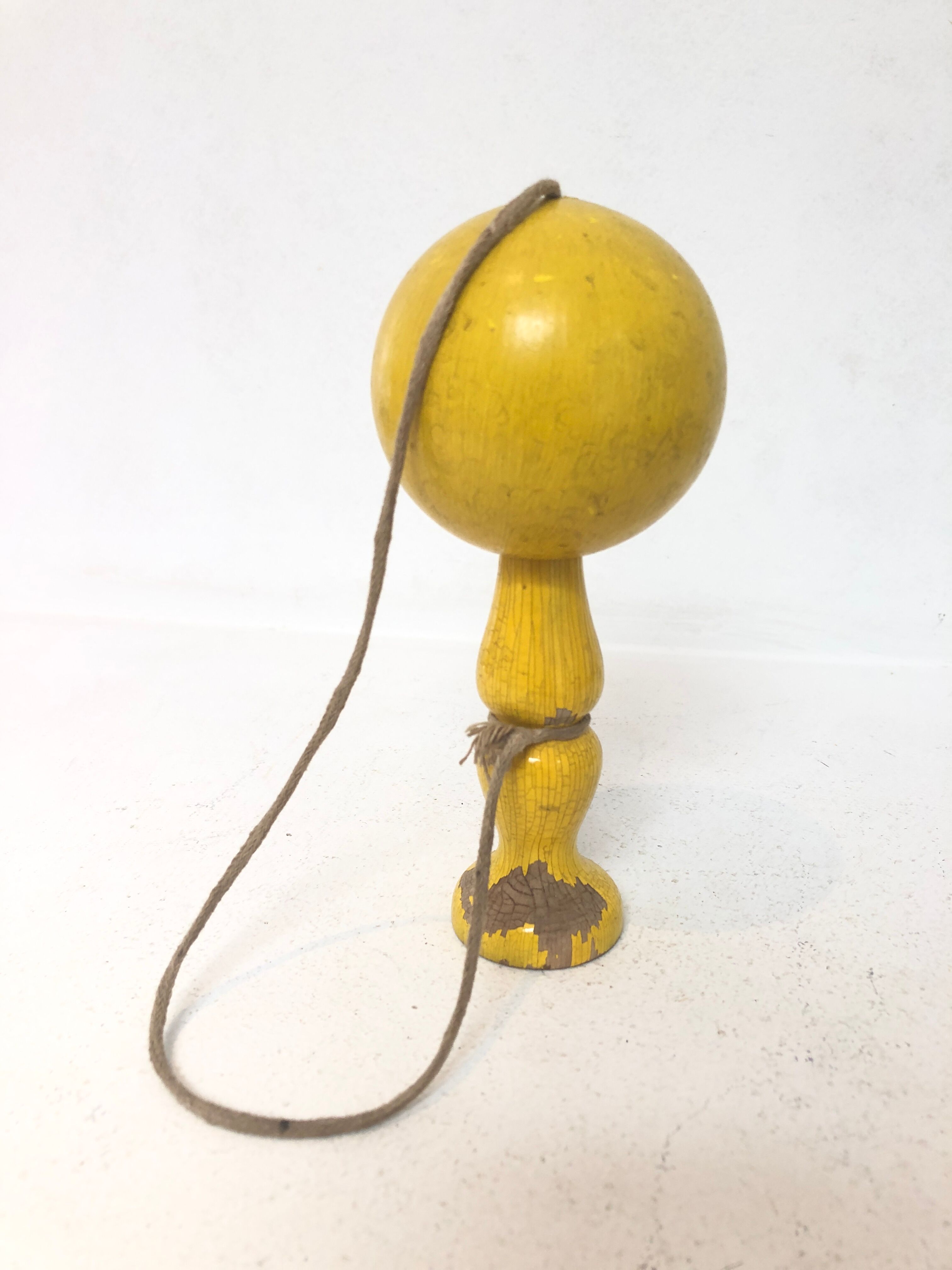Vintage bilboquet in wood, yellow, 1960