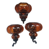 Three large vintage brown glass wall lights