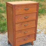 Vintage 1950s chest of drawers with tapered legs and 5 drawers.