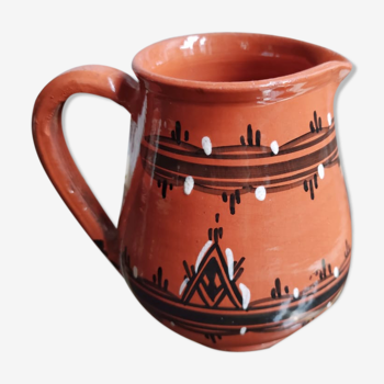 Ochre carafe with white and black geometric friezes