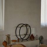 Decorative shelf unit, round metal frames with curved legs and glass shelves, 1960.