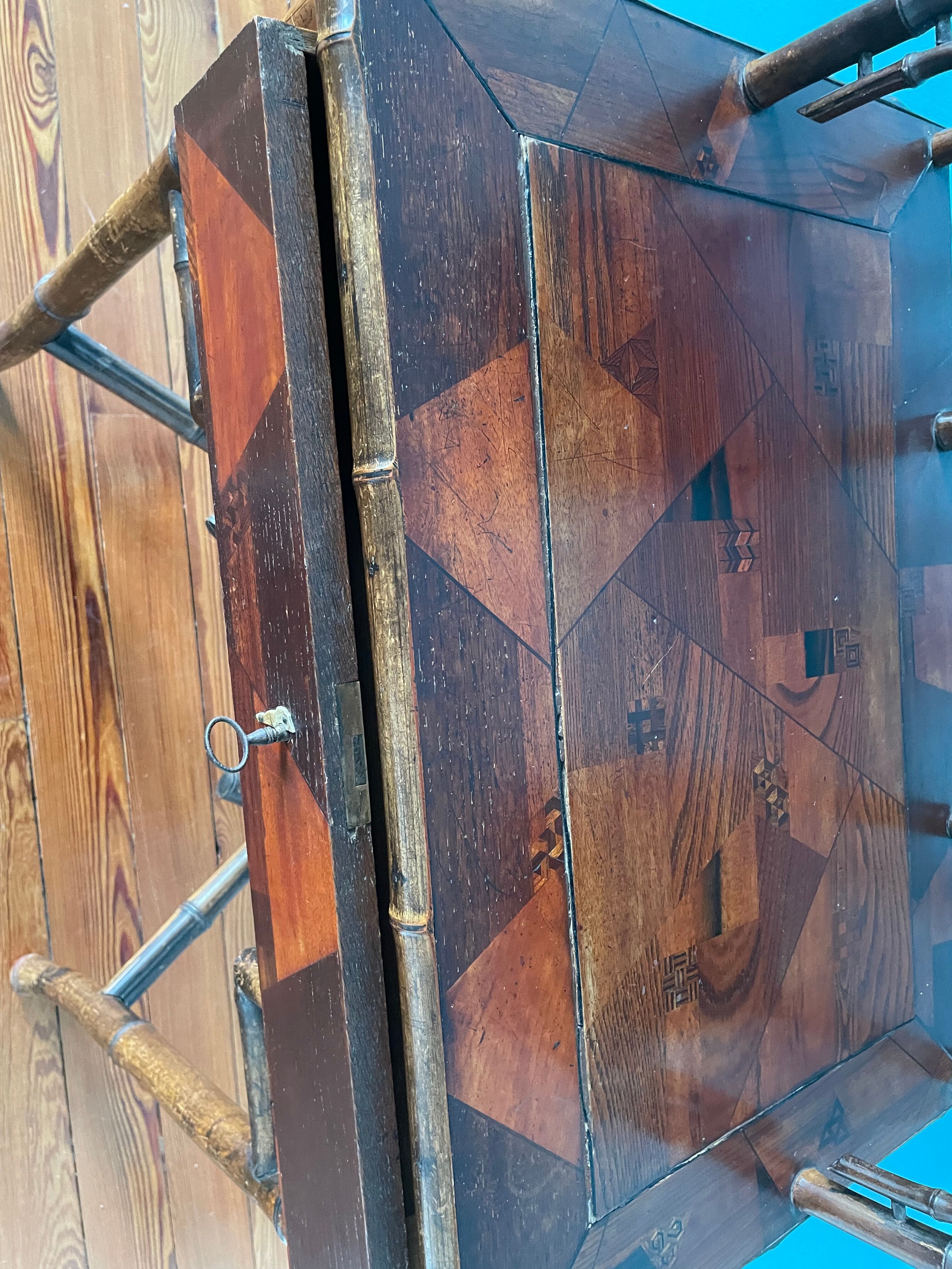 Old secretary in marquetry and bamboo
