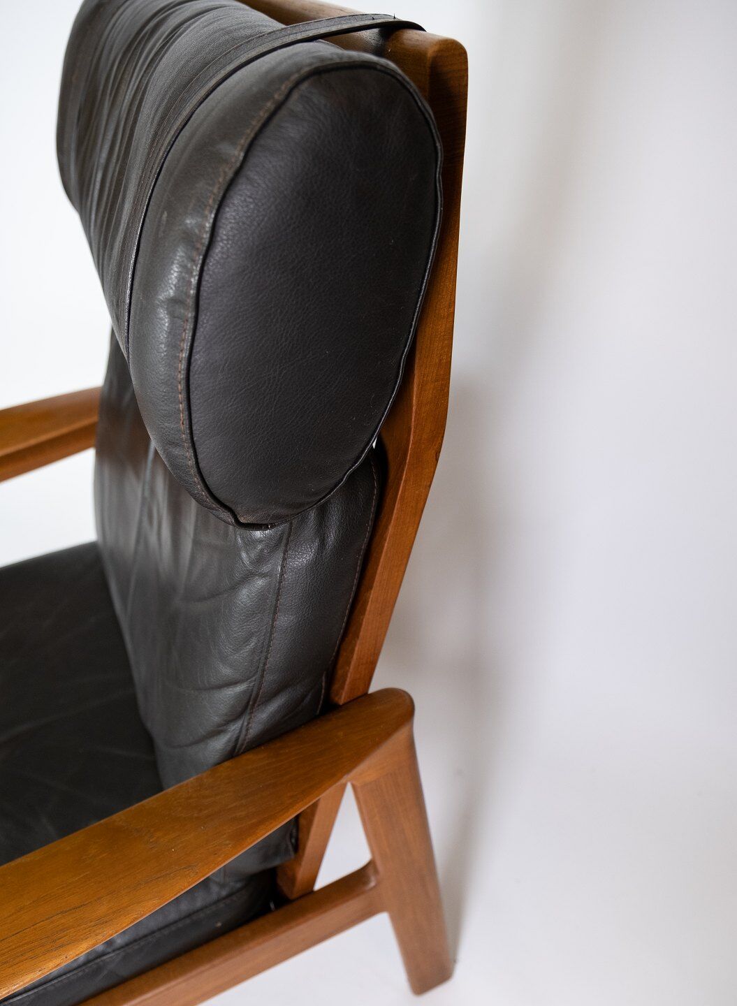 Easy chair with stool in teak upholstered with black leather design Arne Wahl Iversen