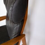Easy chair with stool in teak upholstered with black leather design Arne Wahl Iversen