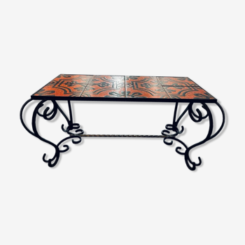 Vintage coffee table in enamelled ceramic and wrought iron.