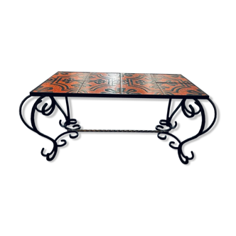 Vintage coffee table in enamelled ceramic and wrought iron.