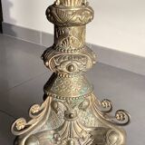 Large bronze candlestick with tripod and winged dog decoration, 19th century.