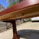 Baumann round oval extendable Scandinavian table in rosewood with 2 extensions.