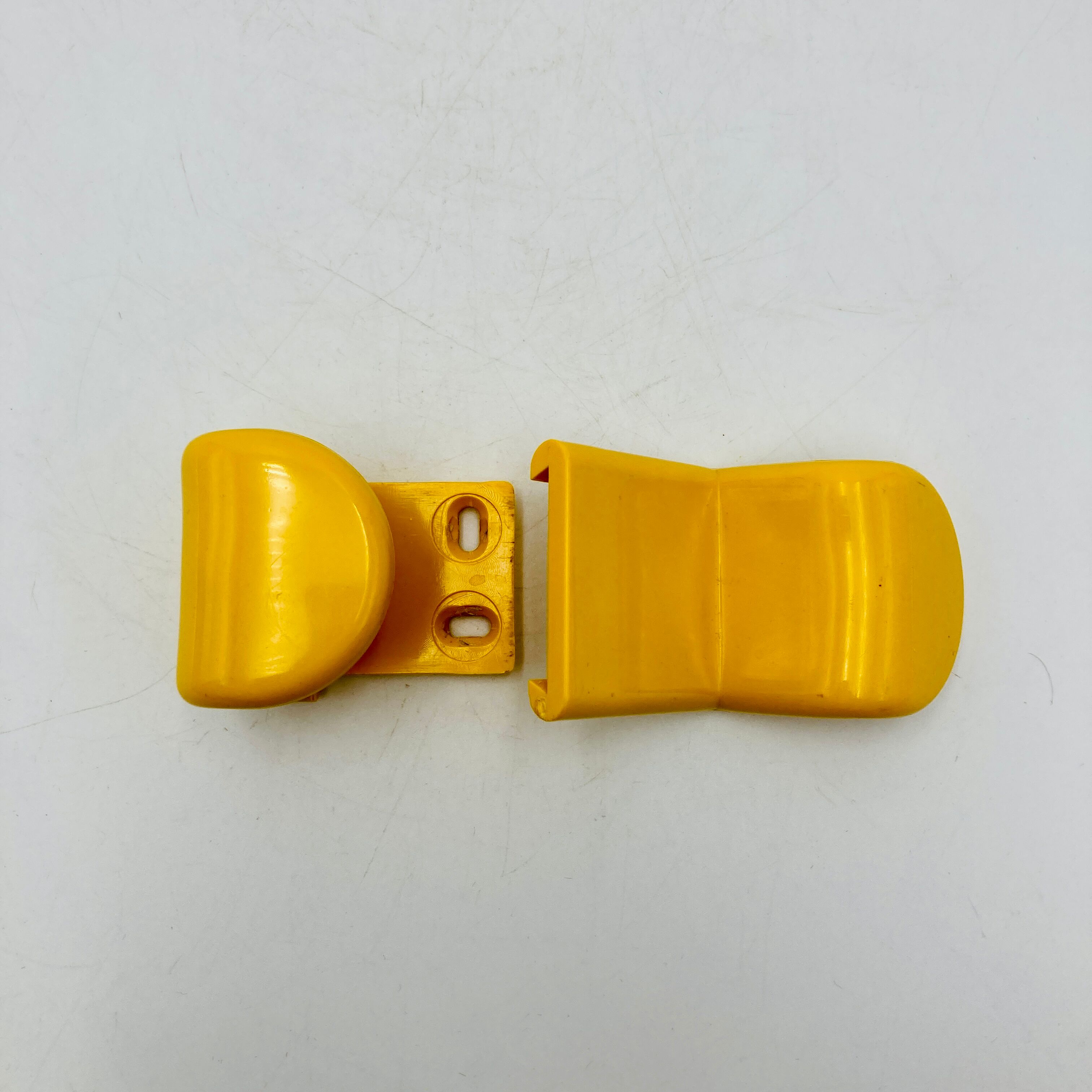 Yellow plastic hooks, design A. Rossari, Gedy edition.