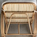 Large rattan rest chair and white cushions