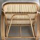 Large rattan rest chair and white cushions