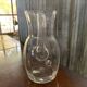 Transparent glass pitcher Mid-Century (1960s) — Czech Republic, bulbous silhouette and integrated handle.