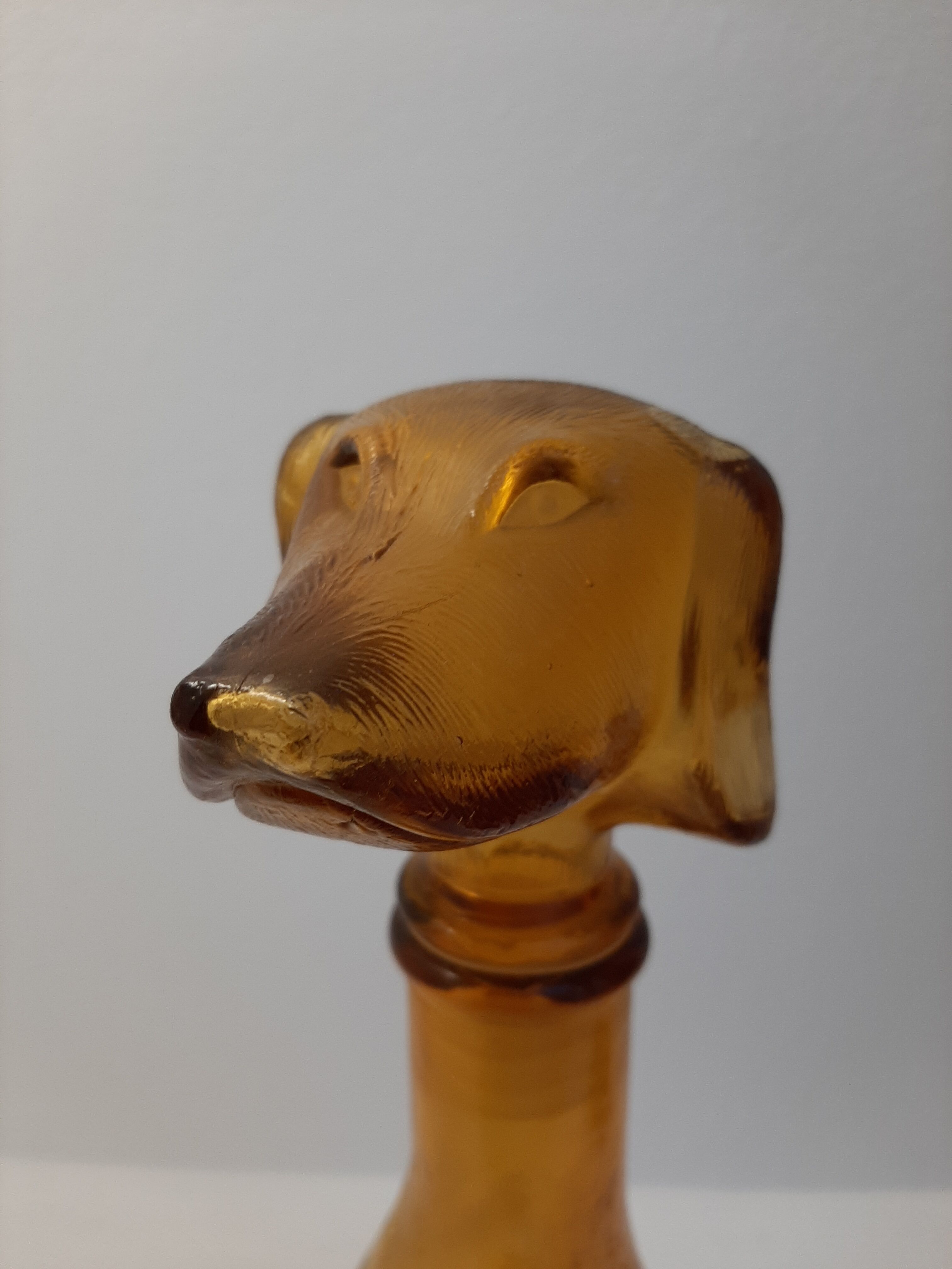 Amber glass bottle representing a dog, Empoli Italy 60s