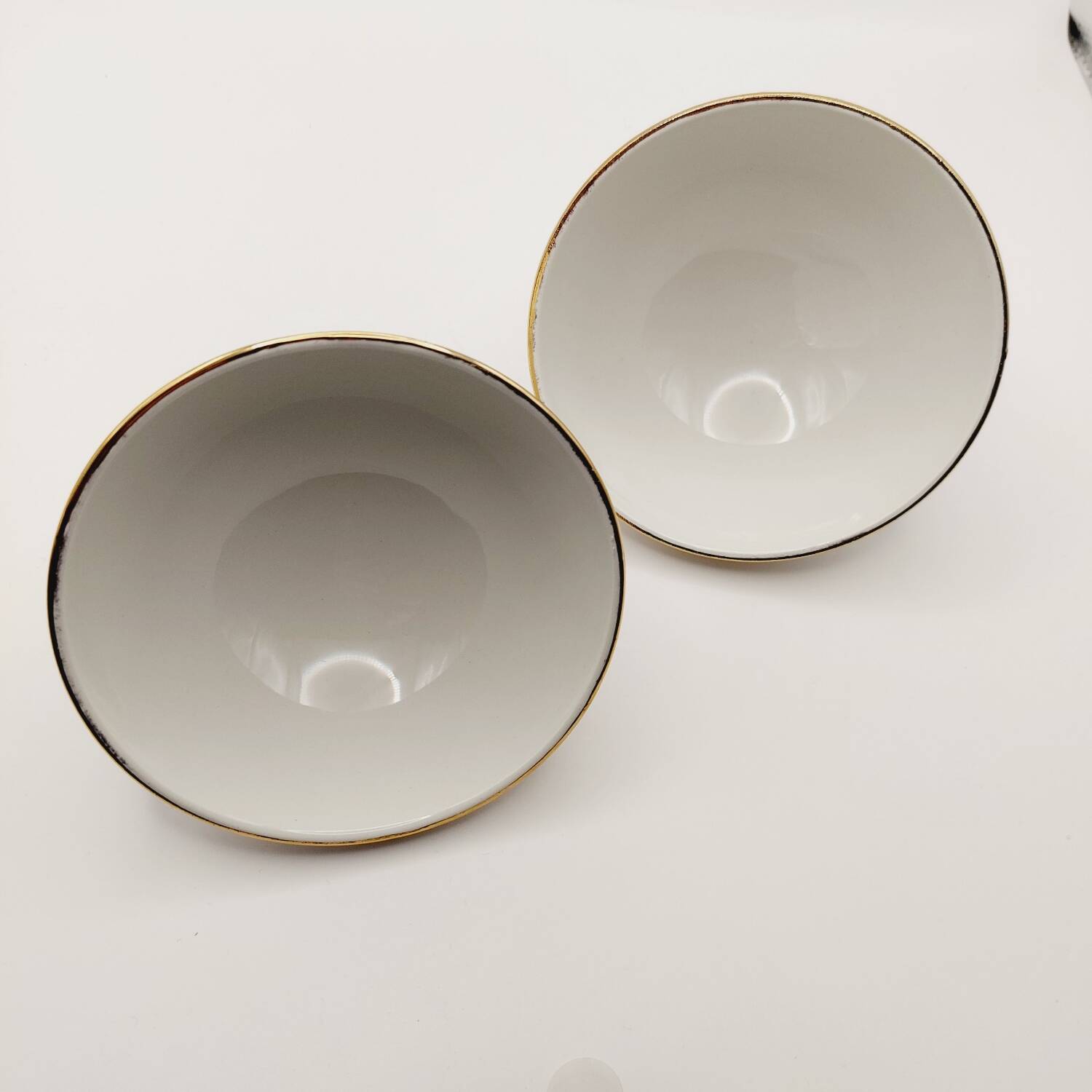 2 small gold ceramic bowls