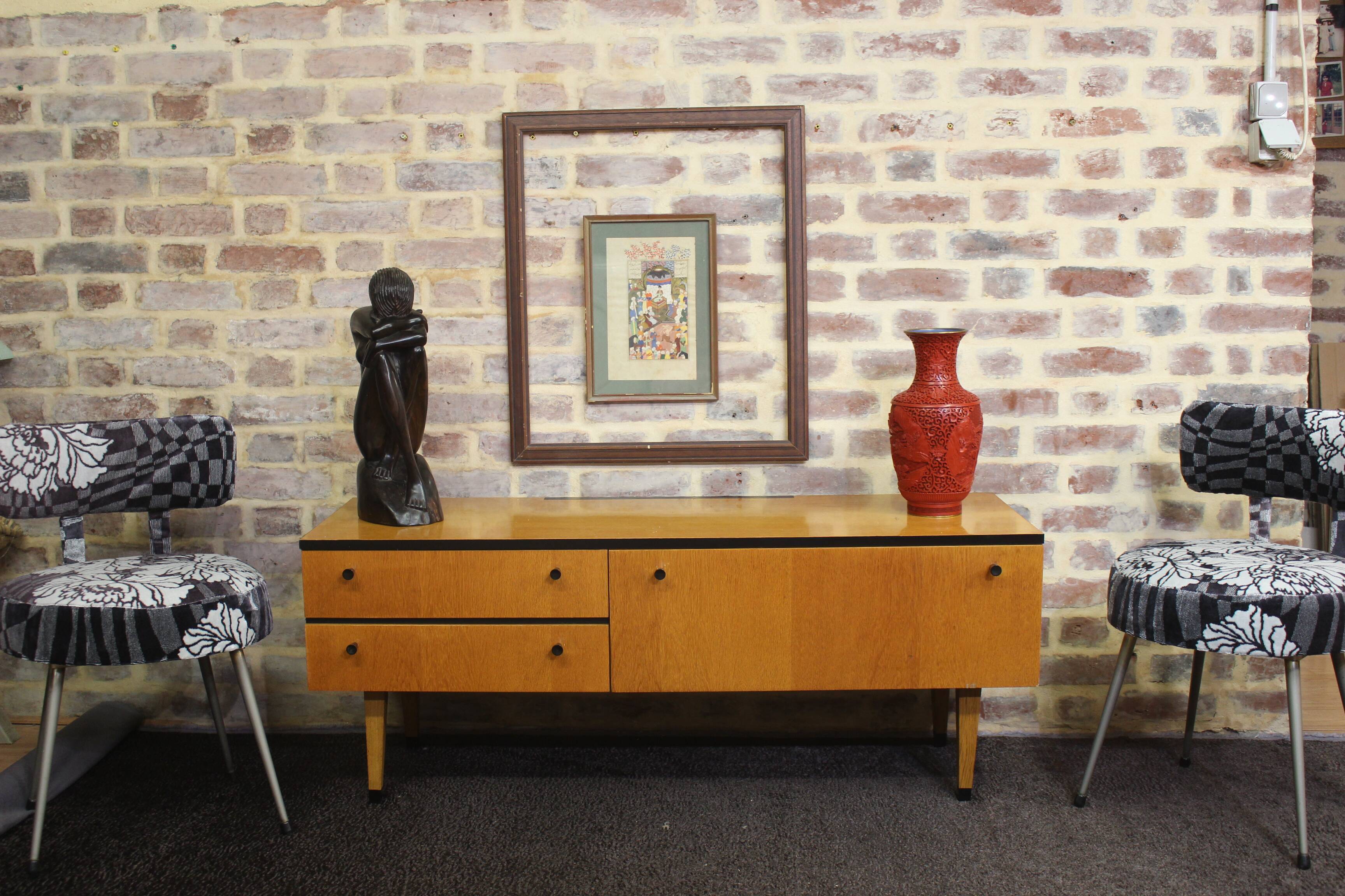 Black-gloved 50s varnished wooden sideboard