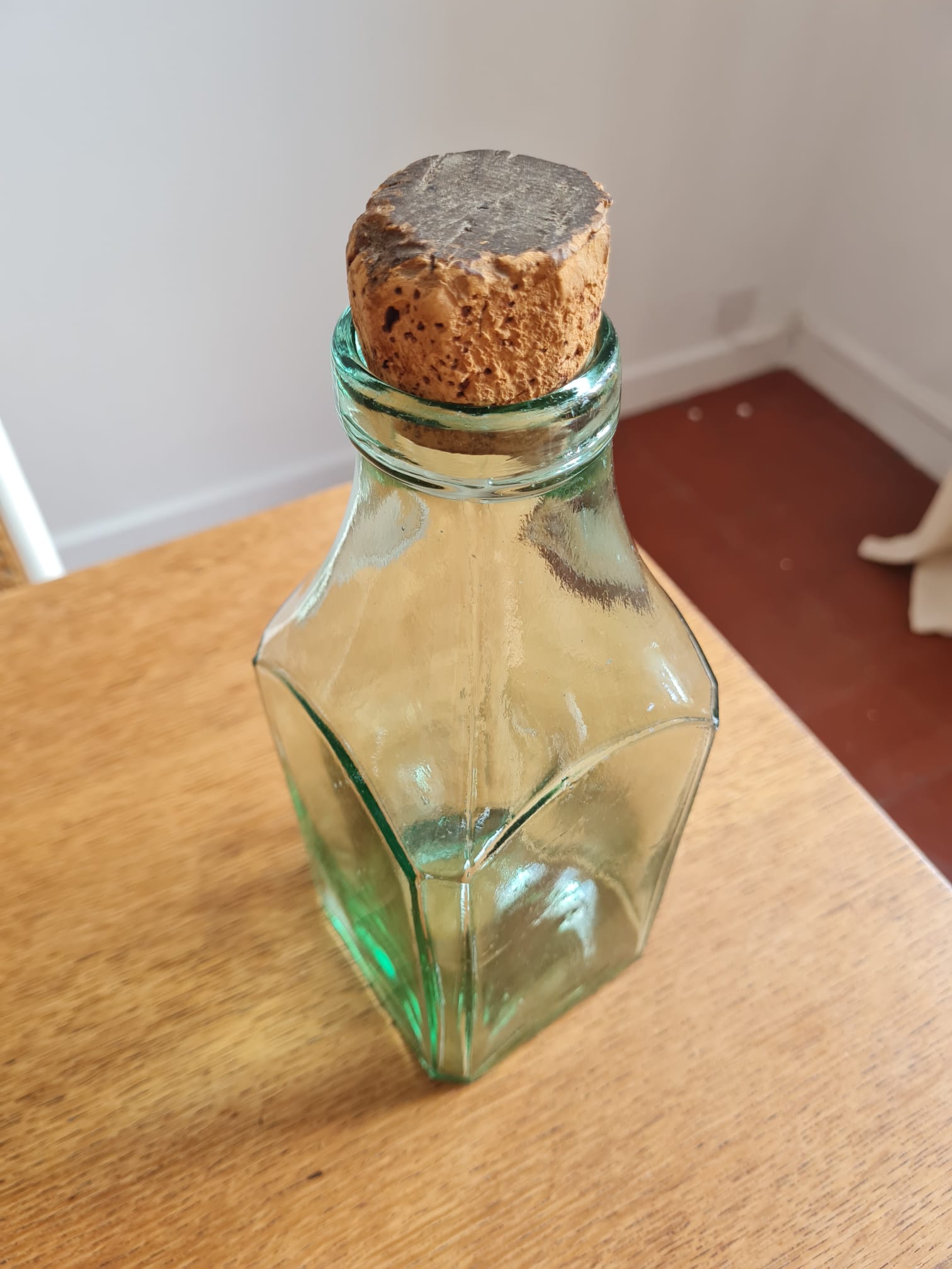 Green blown glass bottle