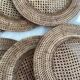 Set of round woven rattan and canework coasters
