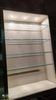 Ivory-colored and matte gold anodized aluminum display bookcase