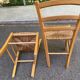 2 solid wood kitchen chairs with straw in a country style