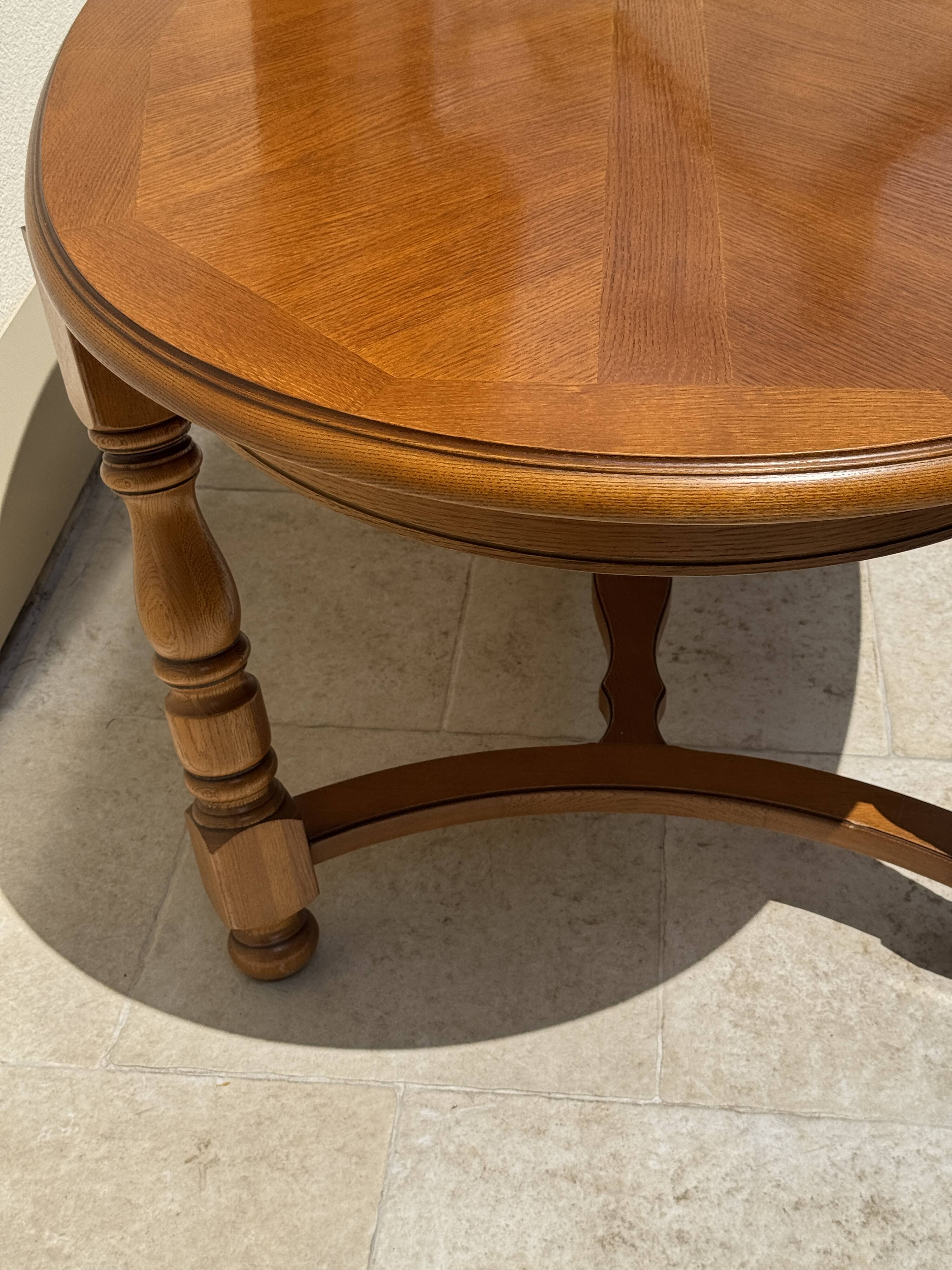 Oak dining table, oval living room table with two extensions.