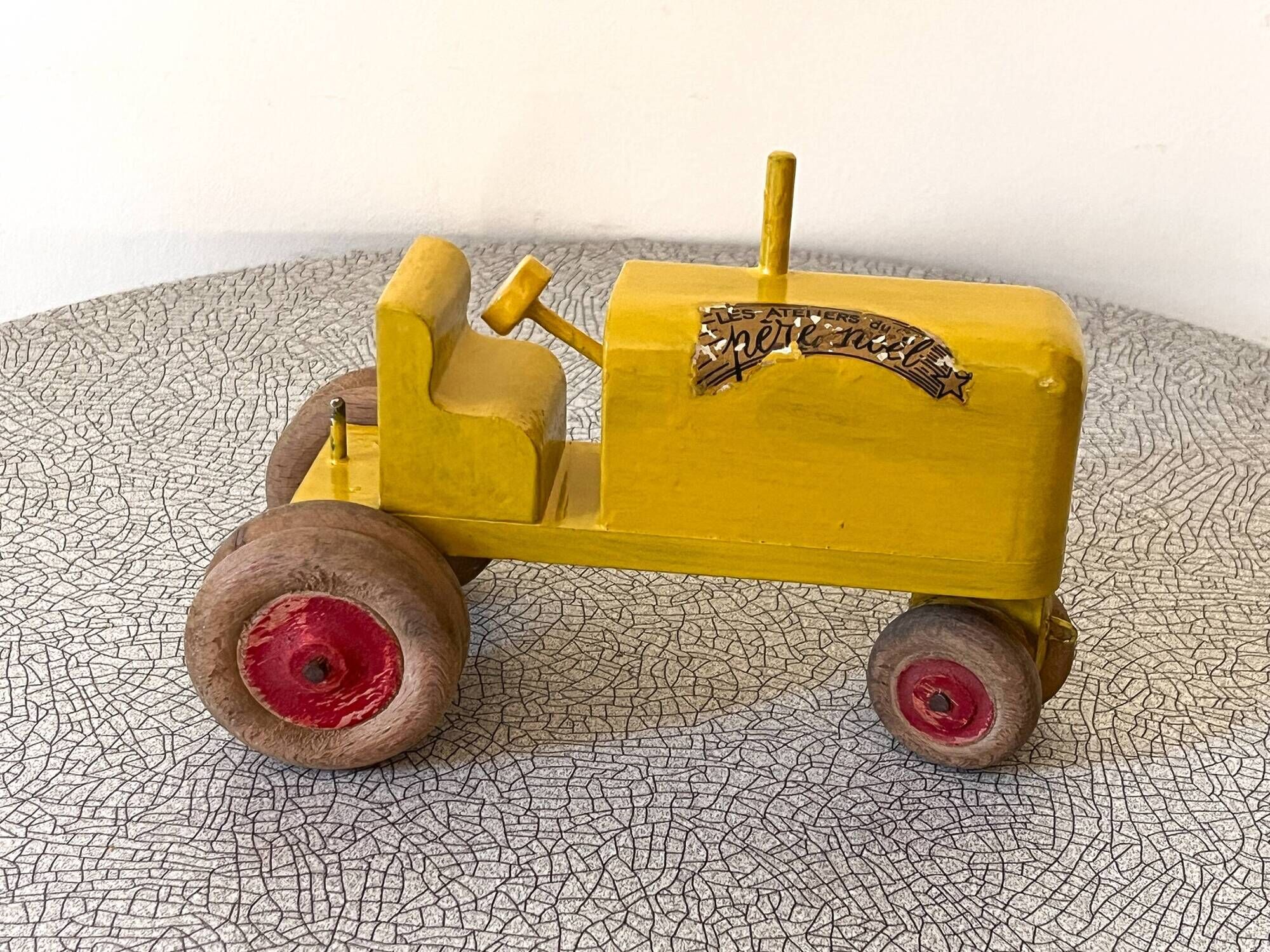 Wooden tractor from the French brand "Ateliers du Père Noël"
