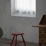 Pair of patinated wooden stools painted red with flared legs, 1950s-1960s.