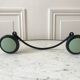 Design coat hook in sage green and black metal from the 70s