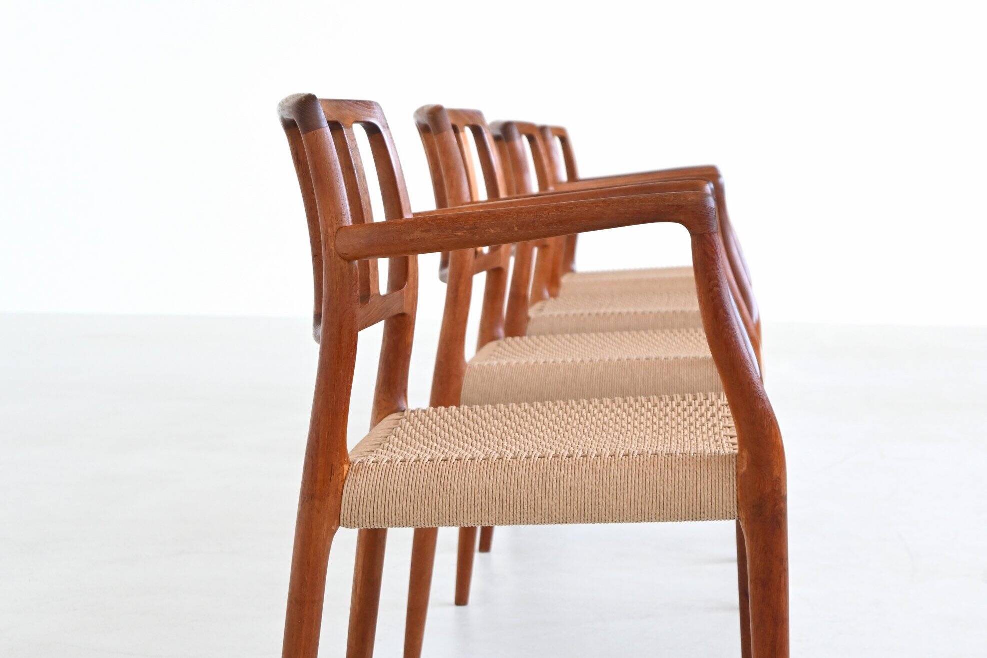 Niels Otto Moller model 66 armchairs teak and paper cord Denmark 1974