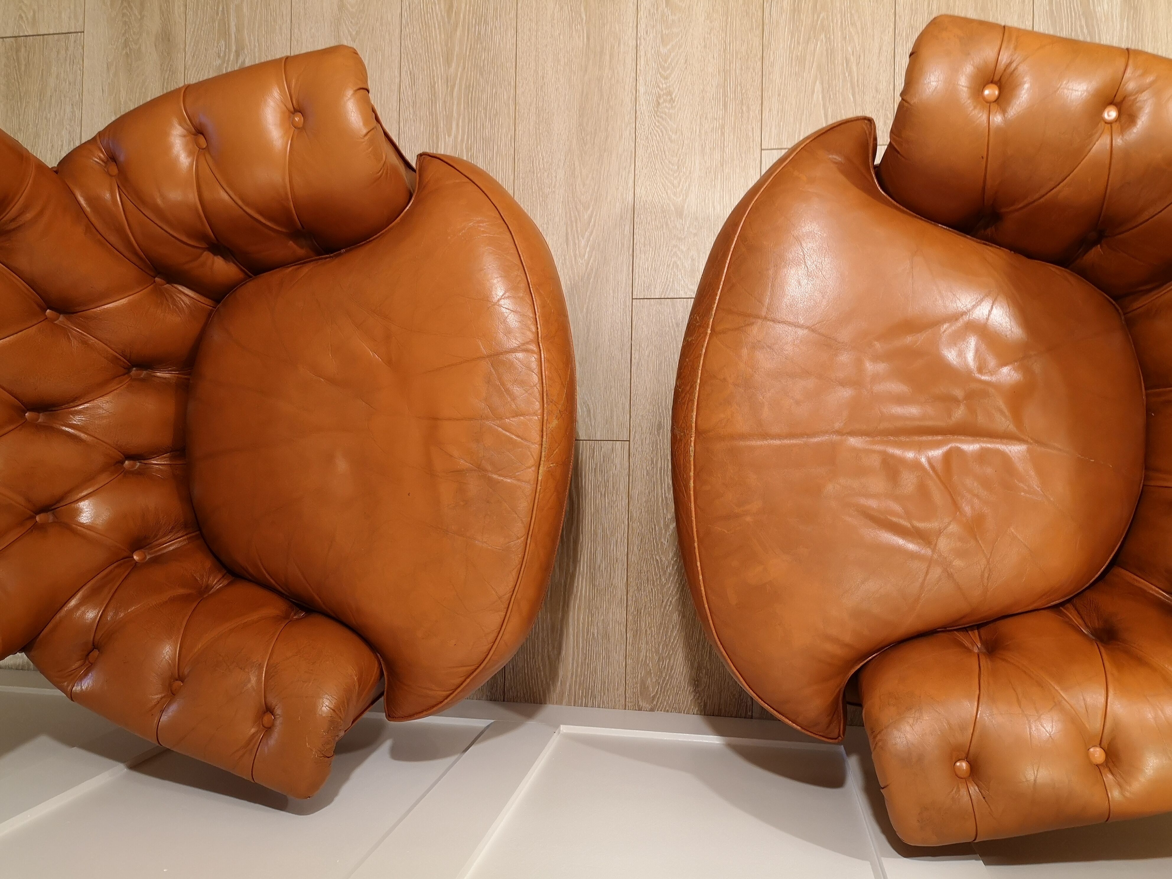Pair of leather chesterfield chairs