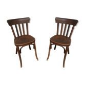 Paire de chaise bistrot en bois galbe sur les côtés du dossier