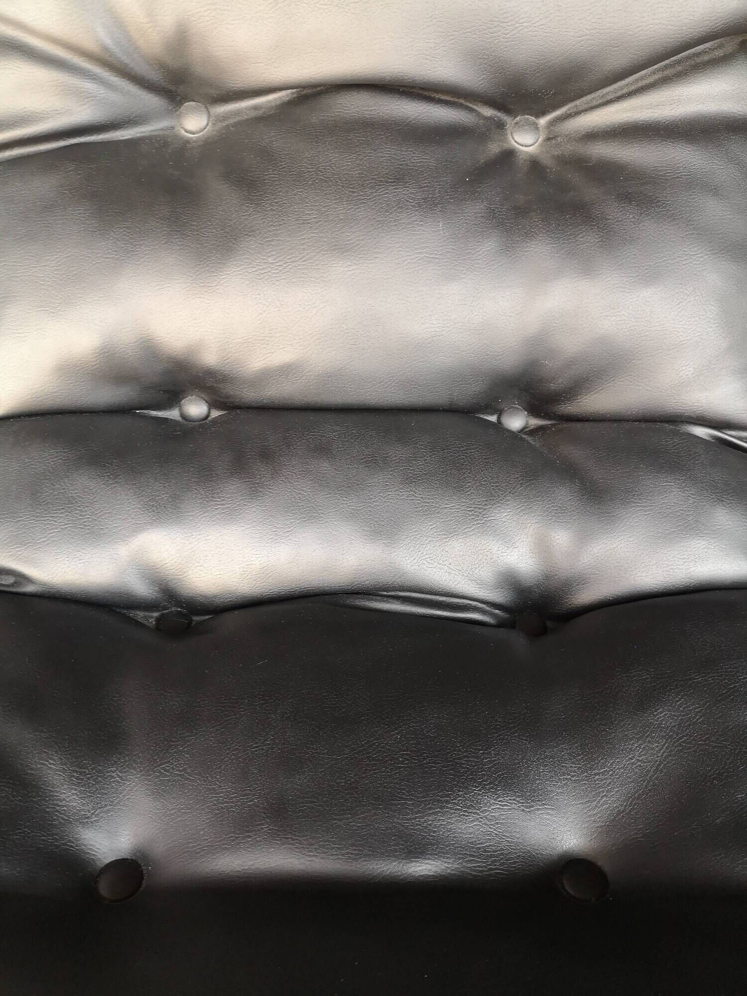 Tubular fireside chair in black skai and metal, design 1970