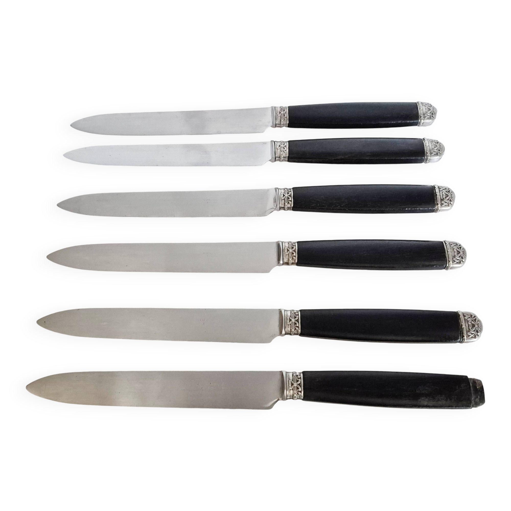 Silver and ebony table knives, stainless steel blade, late 19th century.