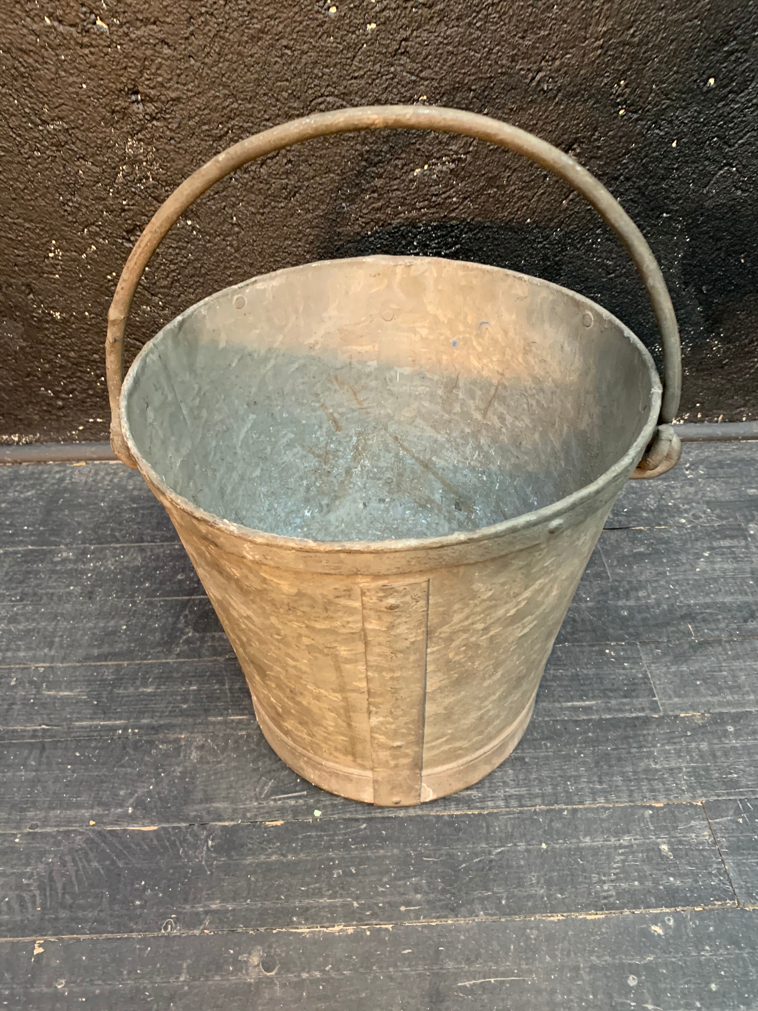 Ancient metal garden bucket