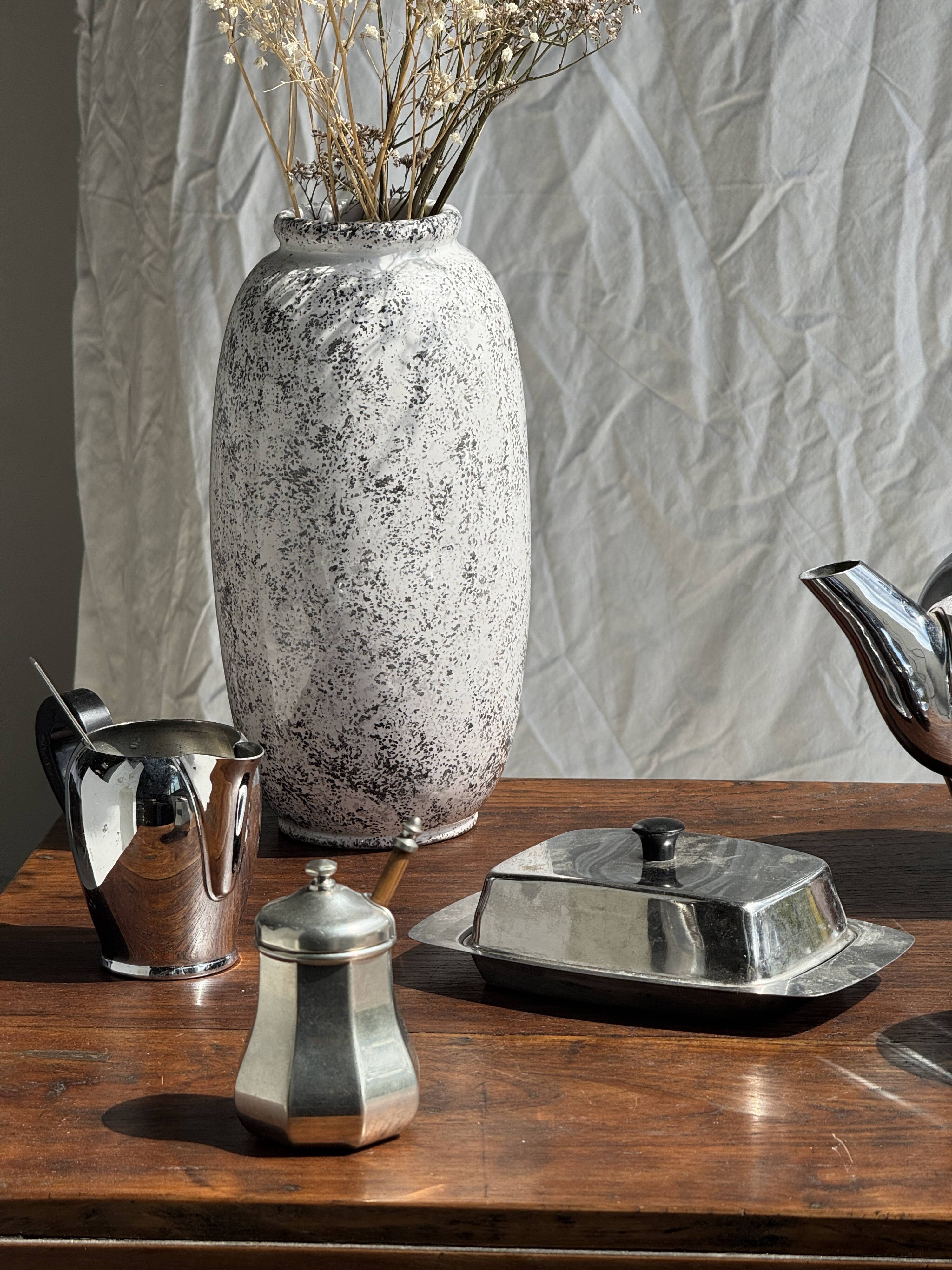 Tea set including teapot, milk jug, sugar bowl and butter dish