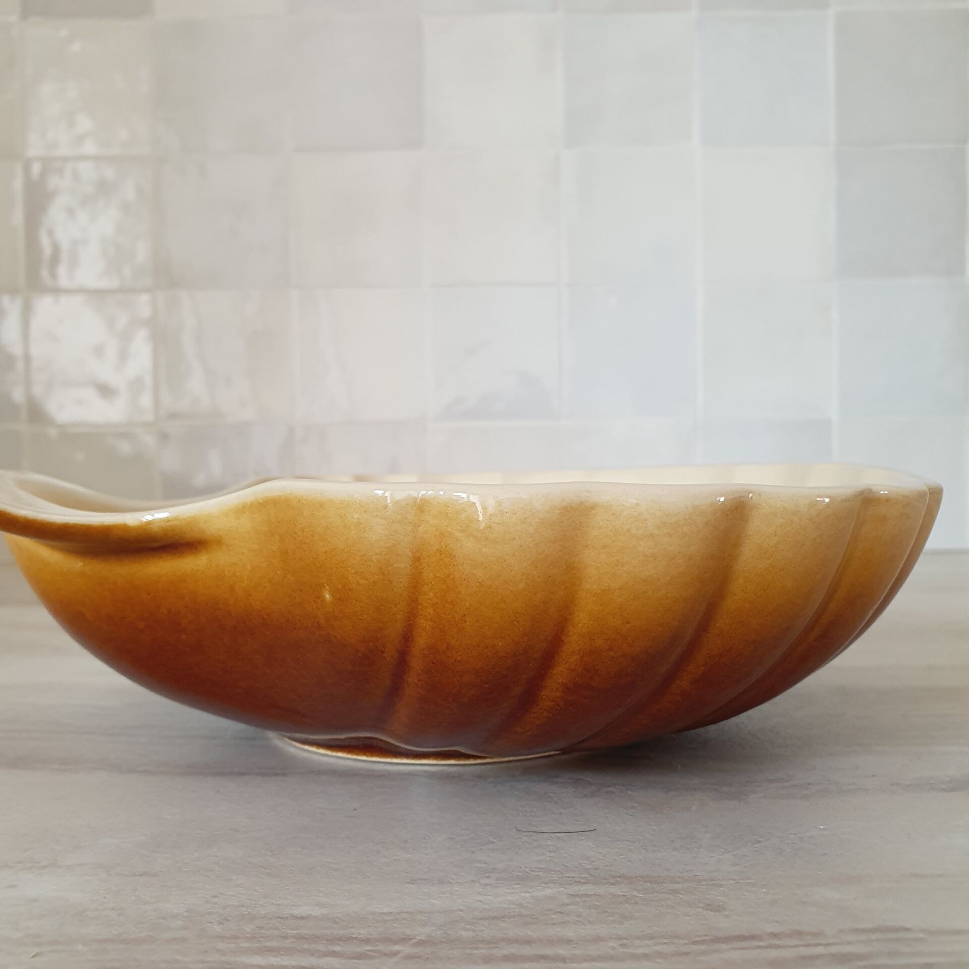 Brown and white ceramic shell bowl