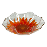Glass cup with orange sunflower