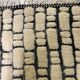 Large cream and black checked Berber rug, 280 × 200 cm.