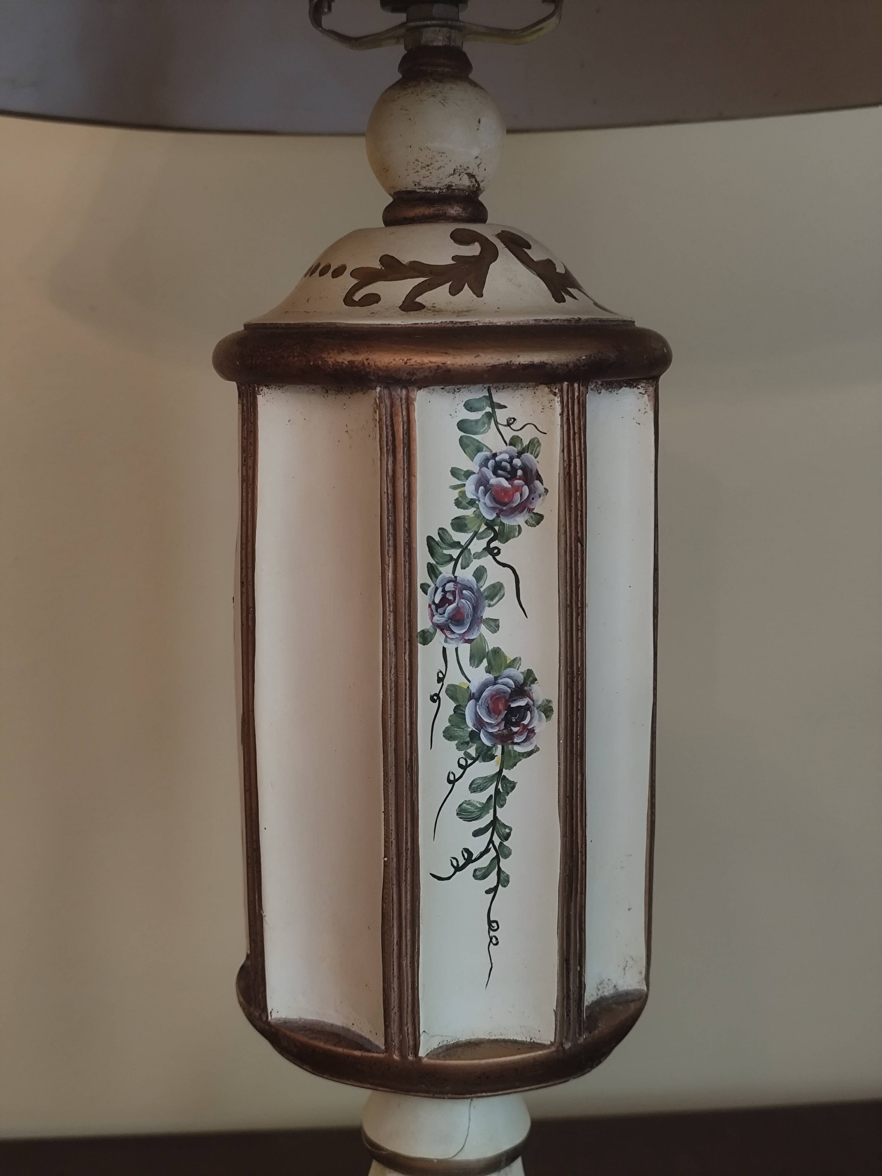 Large pagoda lamp painted with floral patterns and metal shade.
