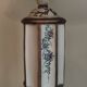 Large pagoda lamp painted with floral patterns and metal shade.