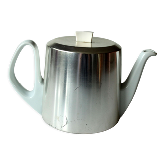 Antique german porcelain tea pot with metal isolated warming hood, vintage from the 1930s