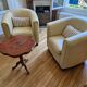 A pair of genuine leather club armchairs.