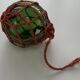 Globe, green glass float and vintage rope