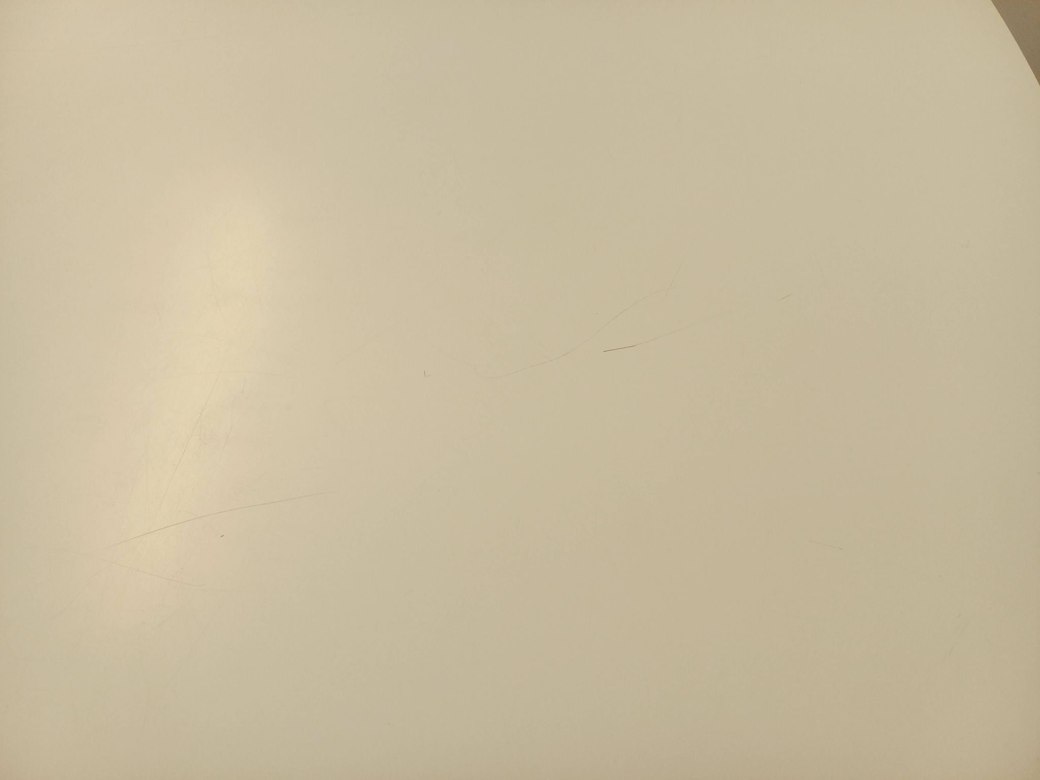 Vintage Eames round table for Vitra in white melamine, wood, and metal.