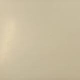 Vintage Eames round table for Vitra in white melamine, wood, and metal.