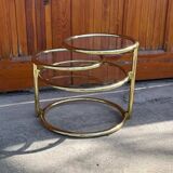 1970s swivel coffee table in gilded brass and glass, Milo Baughman style, vintage design.